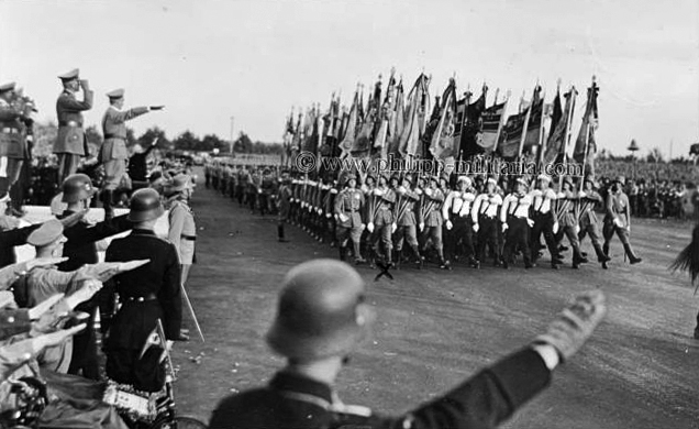 Adolf Hitler salutes the parade of the 12th infantry regiment at the Tag der Wehrmacht in Nuremberg